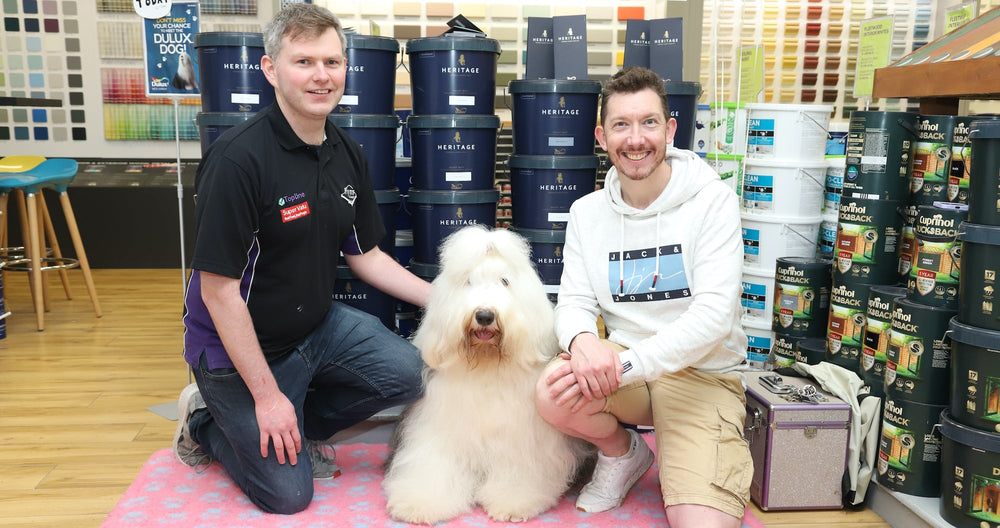 Manus Finnerty and Ronan Lardner with Dulux dog in Flynns of Lackagh Topline hardware store Galway 